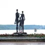 Monument to the Victims of Fascism bronze sculpture of two adults and a child beside a river
