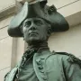 Close-up of the John Paul Jones Memorial bronze statue showing John Paul Jones in a tricorn hat and military coat.