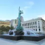 The Fountain of Eternal Life bronze sculpture rises from a large basin with water jets spraying around it.