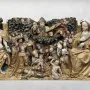 Carved wooden Last Judgement panel with Christ in a crown of thorns, a veiled woman, kneeling figures, and winged figures among dark clouds.