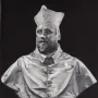 Marble bust of Cardinal Scipione Borghese wearing a clerical cap and buttoned robes.
