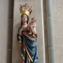 Inkpot Madonna, a colorful statue of the Virgin Mary holding the Christ Child, with an inkpot in her hand.