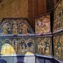 Sant Cugat Casket with ornate gilded panels showing embossed figures and architectural scenes.