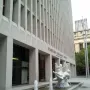 The Quest, a white sculptural fountain with intertwined human figures in a rectangular pool.
