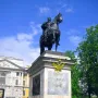 Monument to Peter I, a bronze equestrian statue on a tall stone pedestal with a double-headed eagle emblem.