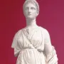 Artemis Diadoumena marble statue of a standing female figure with draped robes, braided hair, and a missing right arm below the shoulder.