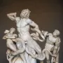 Laocoön and His Sons marble sculpture showing three figures entwined by serpents.