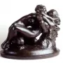 Metamorphoses bronze sculpture of two intertwined nude figures on a round base