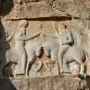 Ardashir Investiture Relief carved into a cliff, showing two mounted figures in a ceremonial exchange with smaller figures below.