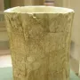 The Situla of the Pania, a pale cylindrical vessel with bands of relief carvings and visible wear.