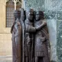 Portrait of the Four Tetrarchs, a dark stone sculpture of four helmeted figures holding swords and embracing in pairs.