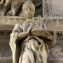 Saint Petronius stone statue in robes and a mitre, holding a miniature walled city.