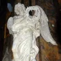 Angel with the Crown of Thorns marble sculpture by Gian Lorenzo Bernini holding a thorny wreath.