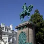 The equestrian bronze statue of Major General George B. McClellan on a tall stone pedestal, with military reliefs at the base.