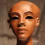 Head of a Princess, a reddish-brown stone sculpture with a slender neck, dark almond-shaped eyes, arched brows, and damaged nose bridge.