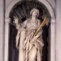 St Bibiana by Bernini, a marble statue of a female figure in flowing robes holding a palm frond.