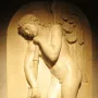 Marble bas-relief from the Monument to Elena Pavlovna showing a sorrowful winged figure leaning on an inverted torch.