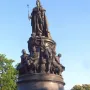 Catherine II Monument with a tall bronze statue and surrounding figures on a tiered pedestal.
