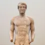Aristodikos Kouros, a nude marble male statue with short curly hair and broken arms on a rectangular base.