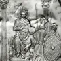 Relief from the Disc of Theodosius showing an enthroned ruler holding an orb, flanked by attendants and columns.