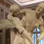 Canova\'s Daedalus and Icarus sculpture in white marble, showing a younger winged figure beside an older bearded man.