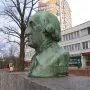 Bronze bust of George Washington on a stone pedestal inscribed \