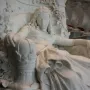 Sleeping Beauty marble sculpture of a resting woman in an ornate carved chair