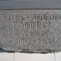 Close-up of the Nathan Bedford Forrest grave marker with carved name and dates.