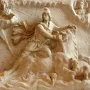 Mithras of Fiano Romano relief showing Mithras slaying the bull, with celestial figures above and a dog and snake below.