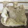 The Goat Amalthea marble sculpture with a shaggy goat and two cherubic figures