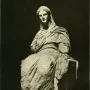 The Demeter of Knidos, a heavily draped seated statue with a tilted head and missing arms, resting on a block-like support and pedestal.