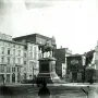Victor Emmanuel II Monument seen from a city square, with a rider on horseback atop a tall stone pedestal.