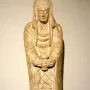 Lady of Cerro de los Santos stone statue holding a small vessel with both hands