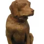 Cane Tago, a seated terracotta dog sculpture on a rectangular base, facing right.