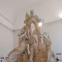 The Farnese Bull marble sculpture showing a dramatic scene with two men struggling to subdue a bull and a female figure beneath it.