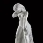 Standing Fauness, a white marble sculpture of a nude female figure with her head bowed and one arm raised.