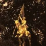 Joan of Arc equestrian statue with an armored rider holding a flag aloft.