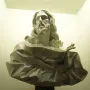 Bust of the Saviour, a white marble bust of a bearded man with long wavy hair and draped robes, gazing upward.